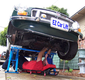 EZcarlift™ creator Boytcho Manev using the portable car lift with an MGB